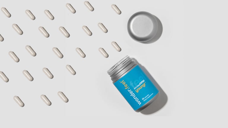 Wonderfeel Youngr NMN capsules and bottle arranged on a white background, highlighting the multi-ingredient formulation studied for real-world benefits
