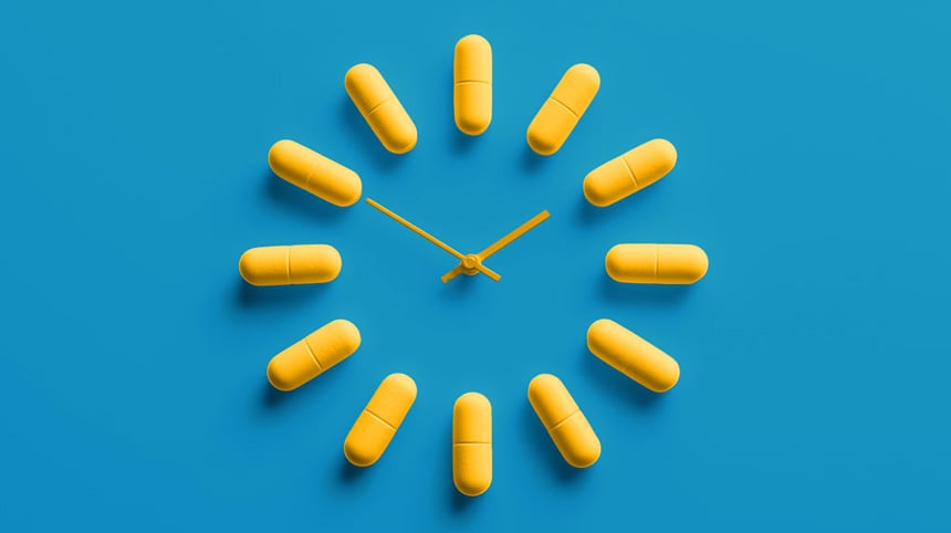 Yellow capsules arranged like a clock on a blue background